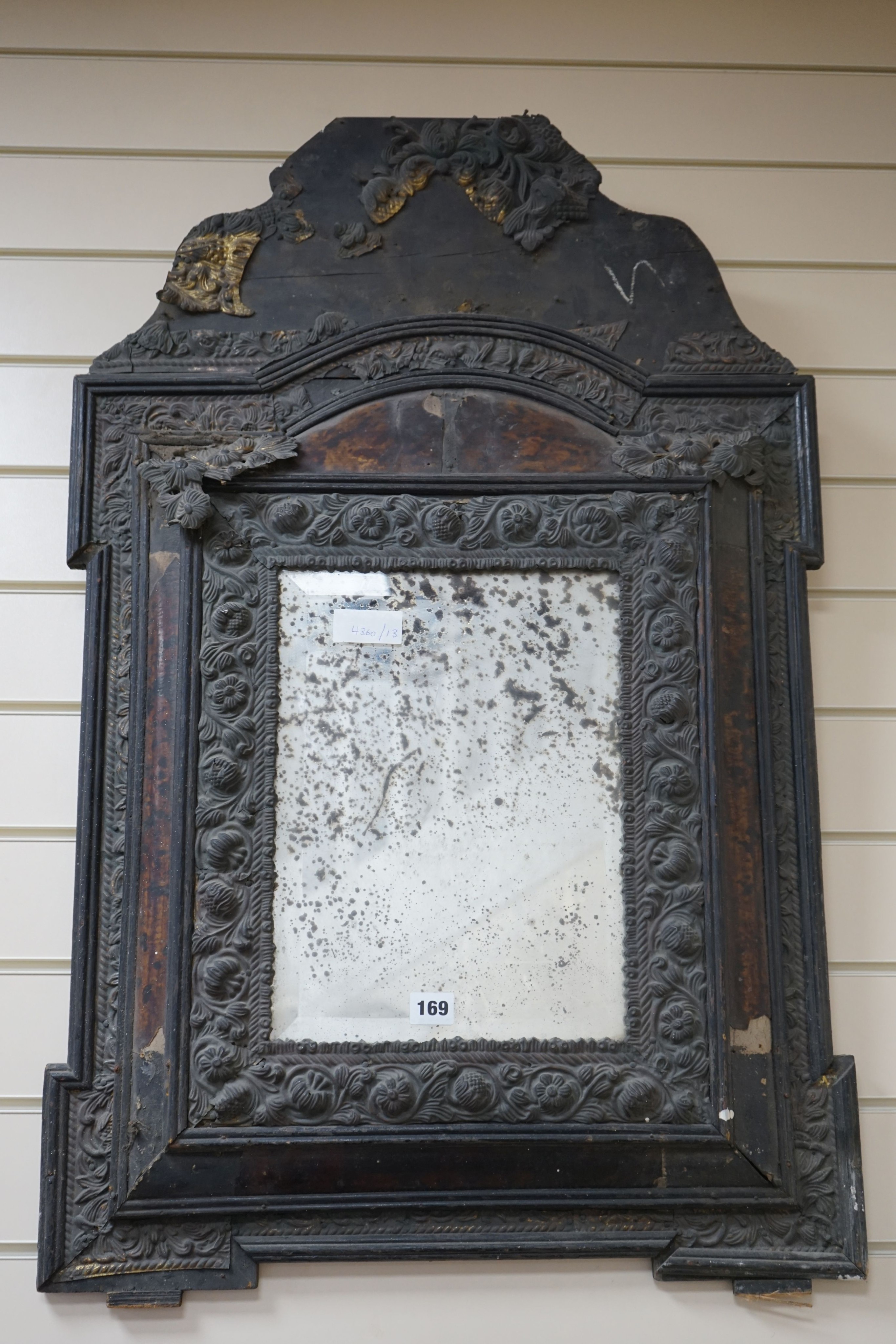 A 19th century Dutch brass and tortoiseshell wall mirror, width 58 cms, height 90 cms.
